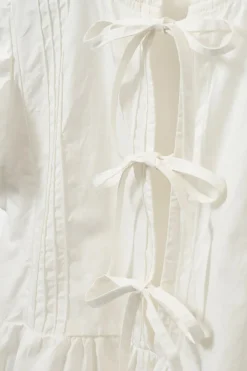 Meisjes blouse mouwloos ecru